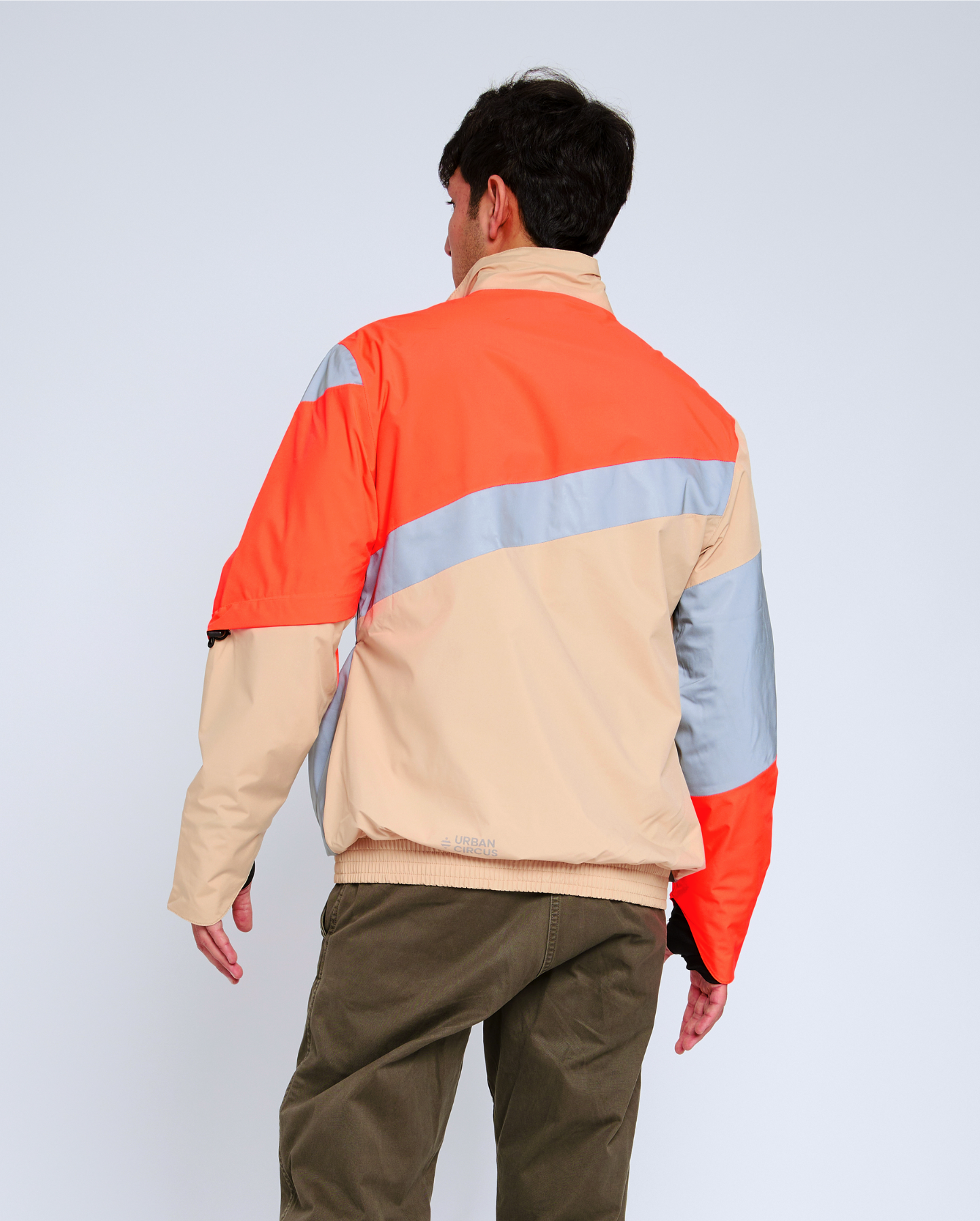 blouson vélo ville dos orange fluo beige